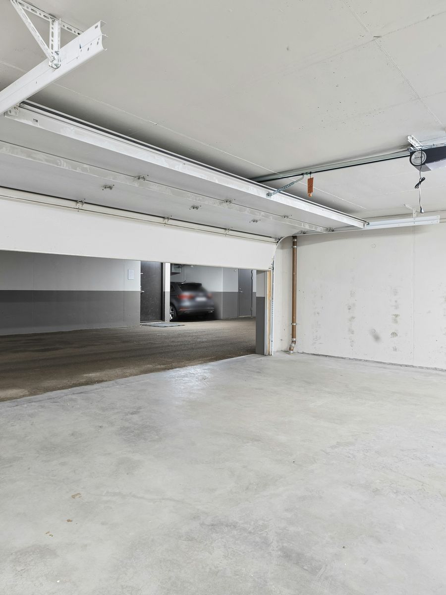 Stock photo of a different, empty garage with clean walls and a bare concrete floor