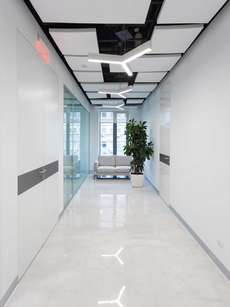 Stock photo of a different, finished office corridor with a polished white floor